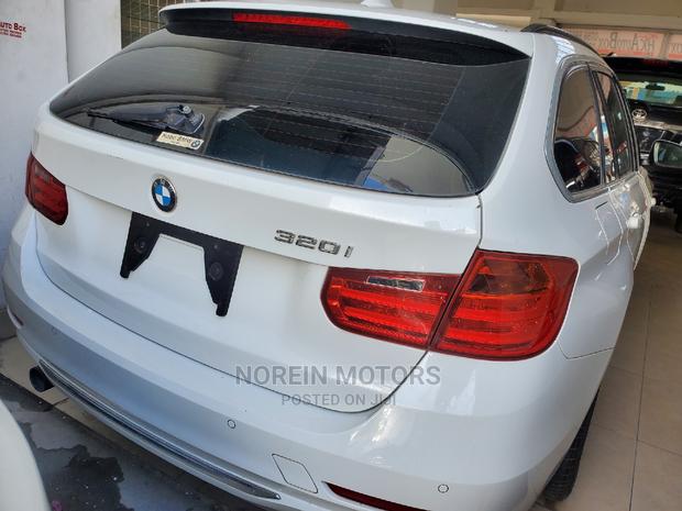 Off-White BMW 320i 2015: High-Performance Compact Sedan