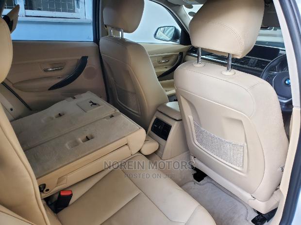 Off-White BMW 320i 2015: High-Performance Compact Sedan