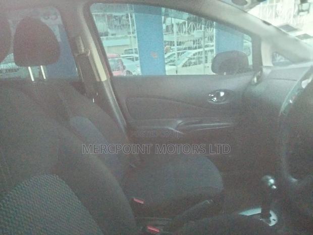 Red Nissan Note 2014: Compact, Stylish, and Economical