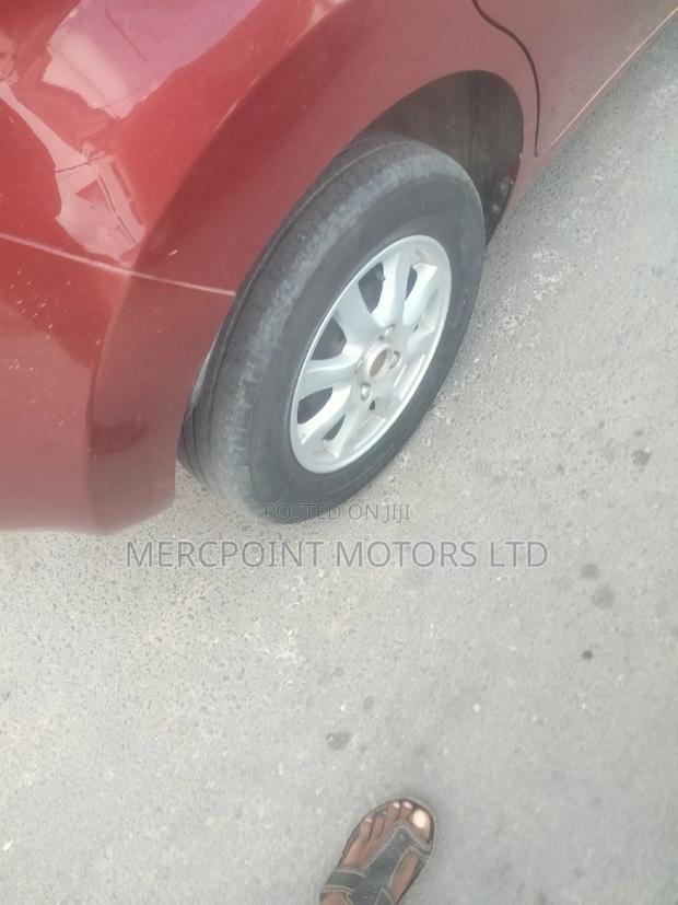 Red Nissan Note 2014: Compact, Stylish, and Economical
