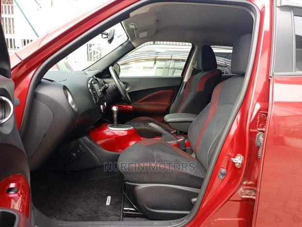 2016 Nissan Juke Red: Pre-owned Red Compact SUV with Modern Design