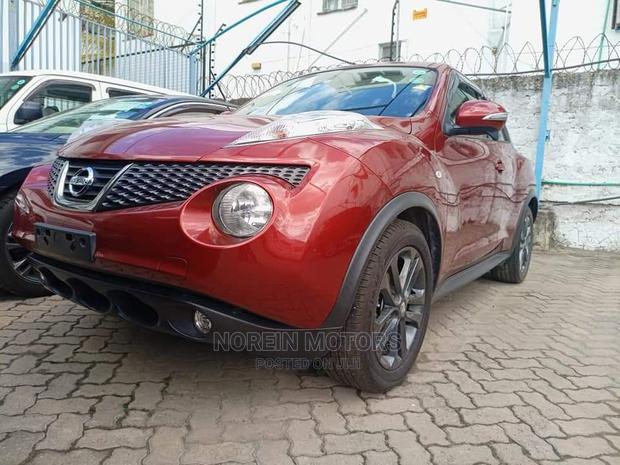 2016 Nissan Juke Red: Pre-owned Red Compact SUV with Modern Design