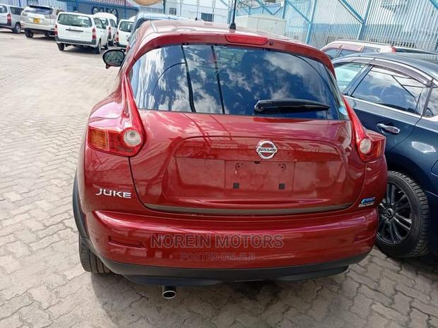 2016 Nissan Juke Red: Pre-owned Red Compact SUV with Modern Design