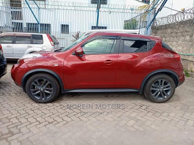 2016 Nissan Juke Red: Pre-owned Red Compact SUV with Modern Design