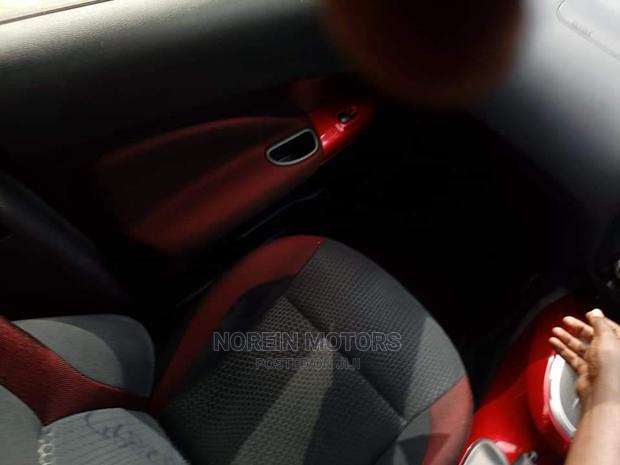 2016 Nissan Juke Red: Pre-owned Red Compact SUV with Modern Design