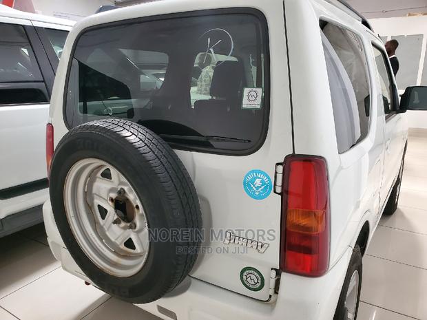 2015 Suzuki Jimny White: Compact, Powerful, and Ready for Your Adventure