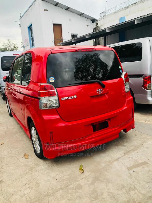 Toyota Spade 2015 in Red: Luxury and Practicality at Your Fingertips!