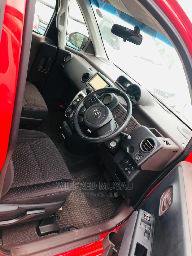 Toyota Spade 2015 in Red: Luxury and Practicality at Your Fingertips!
