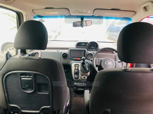 Toyota Spade 2015 in Red: Luxury and Practicality at Your Fingertips!