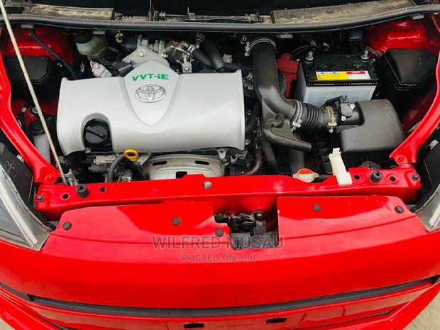 Toyota Spade 2015 in Red: Luxury and Practicality at Your Fingertips!