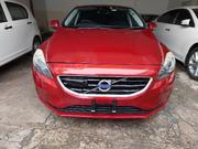 Volvo V40 2015 - Red Sedan: Stylish and sophisticated, this Volvo V40 2015 Red Sedan offers a blend of power and elegance. for sale