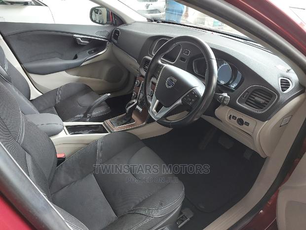 Volvo V40 2015 - Red Sedan: Stylish and sophisticated, this Volvo V40 2015 Red Sedan offers a blend of power and elegance.