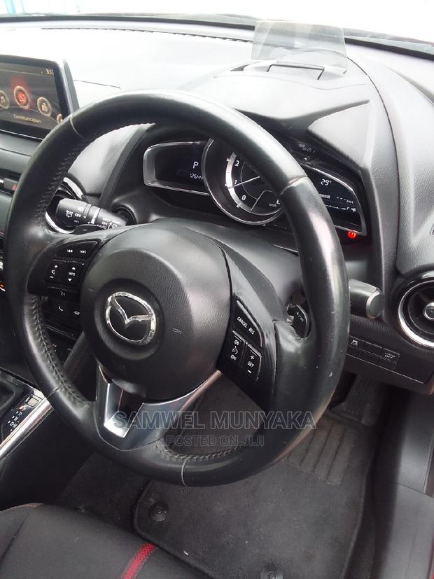 2016 Red Mazda Demio - Pre-Owned Sedan Offering a Great Driving Experience