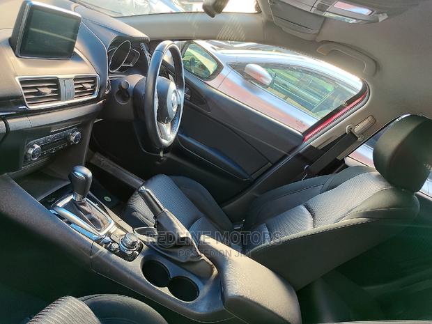 2016 Mazda Axela: Red Sedan for the Modern Driver