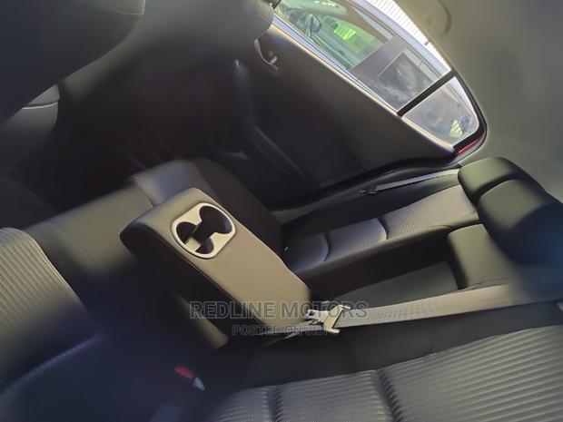 2016 Mazda Axela: Red Sedan for the Modern Driver