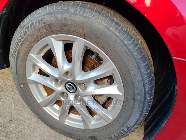 2016 Mazda Axela: Red Sedan for the Modern Driver