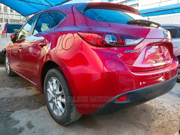 2016 Mazda Axela: Red Sedan for the Modern Driver
