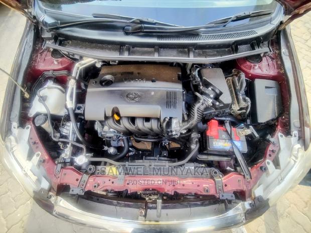 Compact Red Toyota Premio 1.5 FWD 2013 - Luxury Sedan