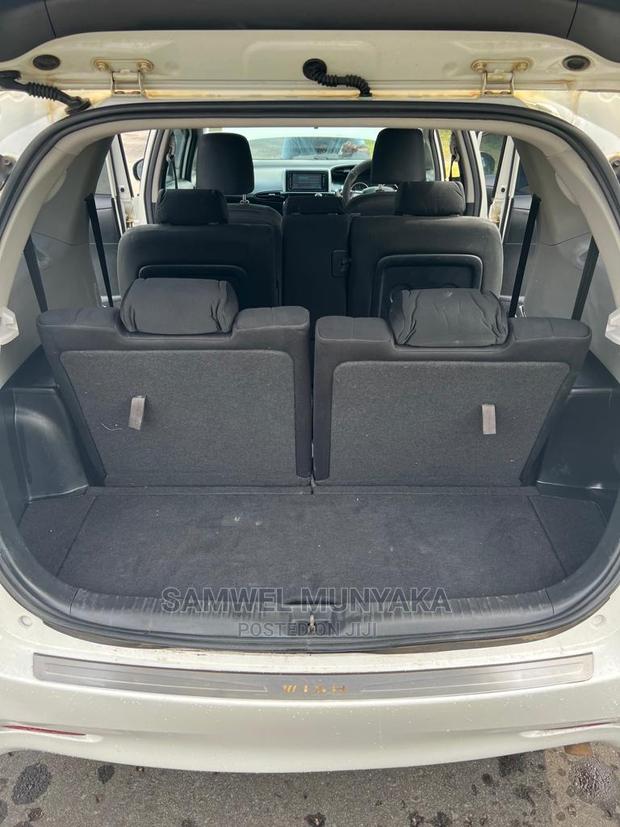 2010 Pearl Toyota Wish - Pre-Owned Sedan with Style and Comfort