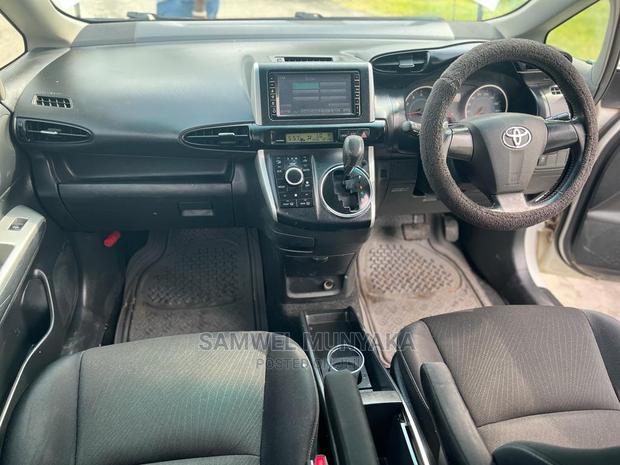 2010 Pearl Toyota Wish - Pre-Owned Sedan with Style and Comfort