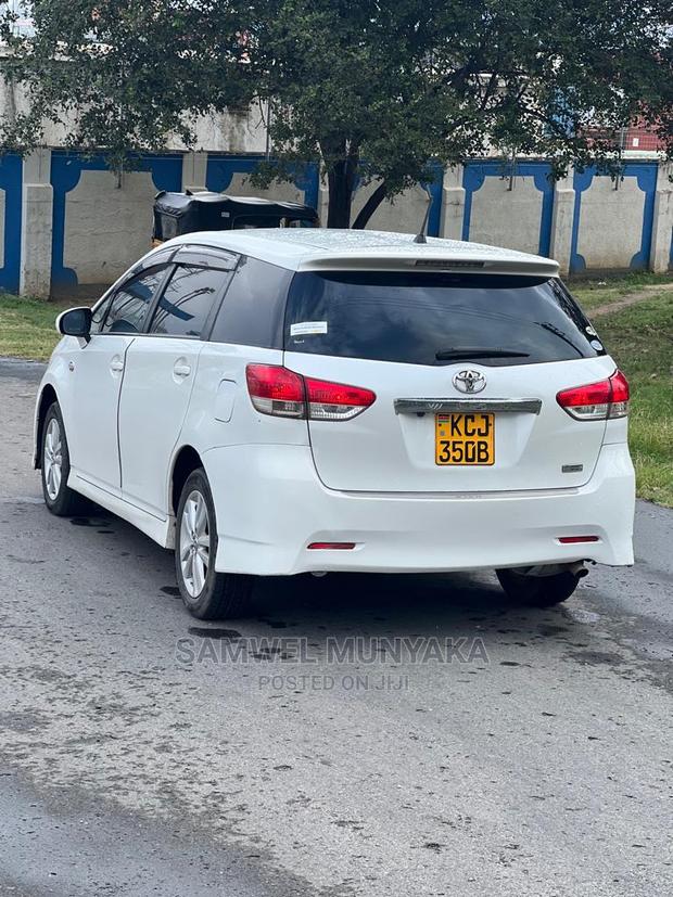 2010 Pearl Toyota Wish - Pre-Owned Sedan with Style and Comfort