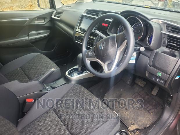 Brown 2016 Honda Fit: Compact Car for Urban Living