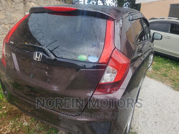 Brown 2016 Honda Fit: Compact Car for Urban Living