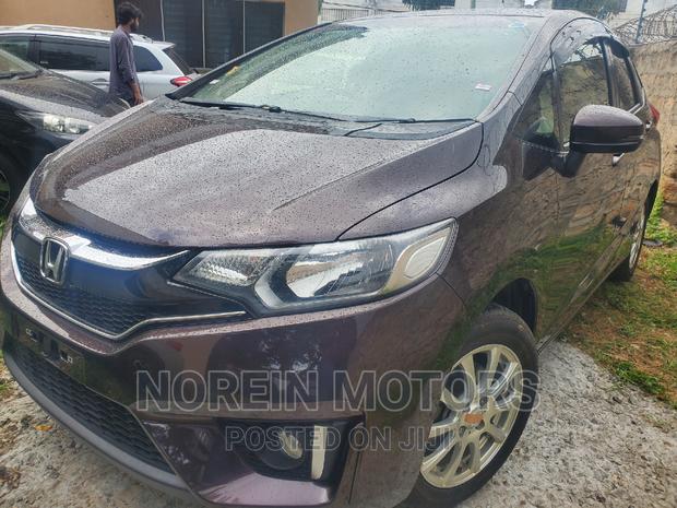 Brown 2016 Honda Fit: Compact Car for Urban Living