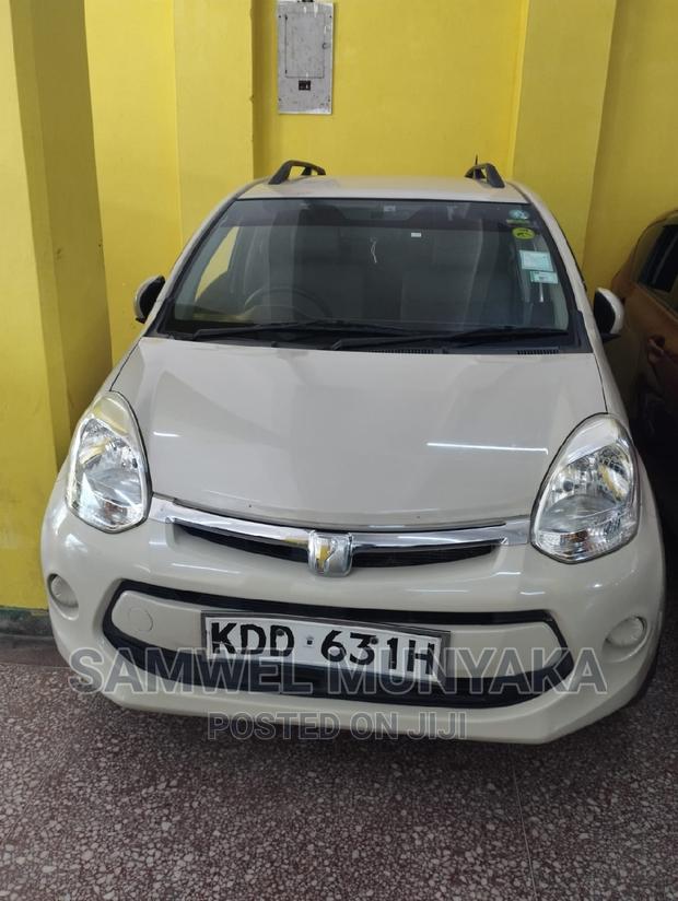 2014 Toyota Passo AWD Beige - Compact Car with All-Wheel Drive