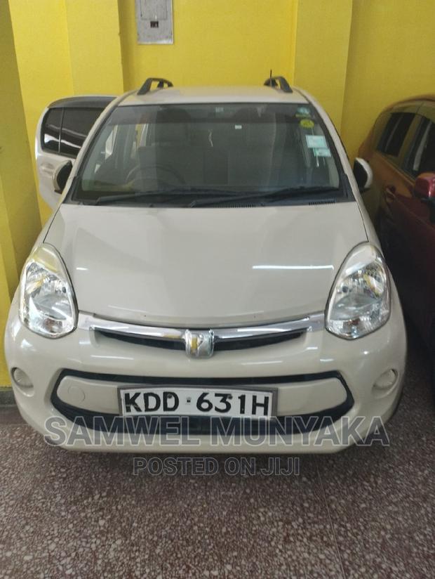 2014 Toyota Passo AWD Beige - Compact Car with All-Wheel Drive