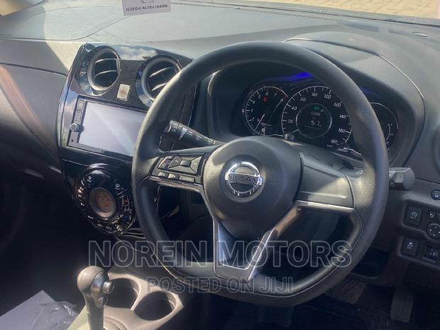 Yellow 2016 Nissan Note: Compact Car with a Sunny Personality!
