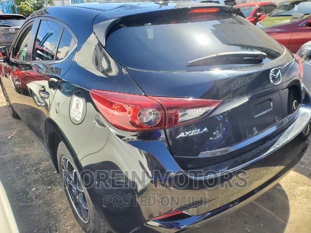 Black 2016 Mazda Axela: Sophisticated and Efficient Sedan