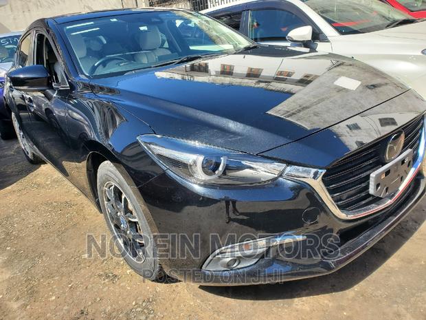 Black 2016 Mazda Axela: Sophisticated and Efficient Sedan