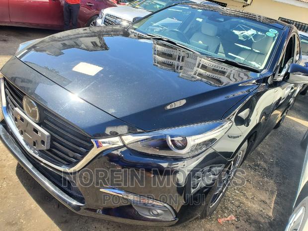 Black 2016 Mazda Axela: Sophisticated and Efficient Sedan