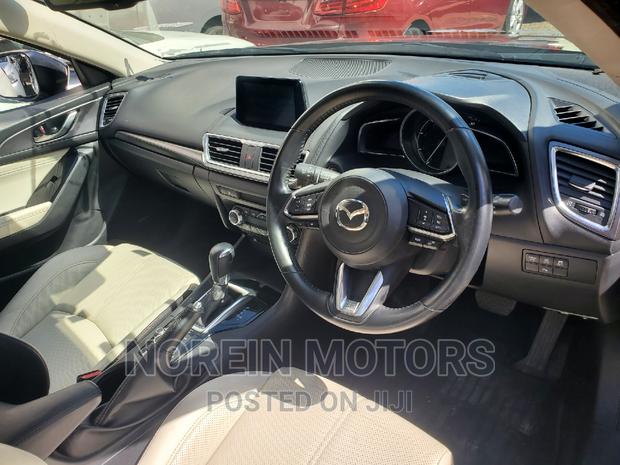 Black 2016 Mazda Axela: Sophisticated and Efficient Sedan