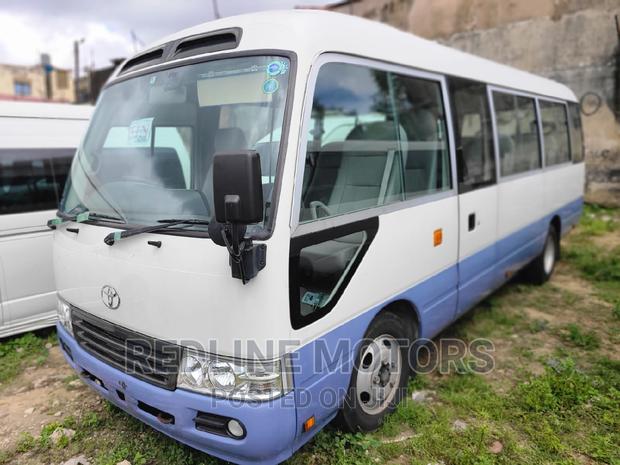 2016 Toyota Coaster White - Affordable Minibus with Multiple Options