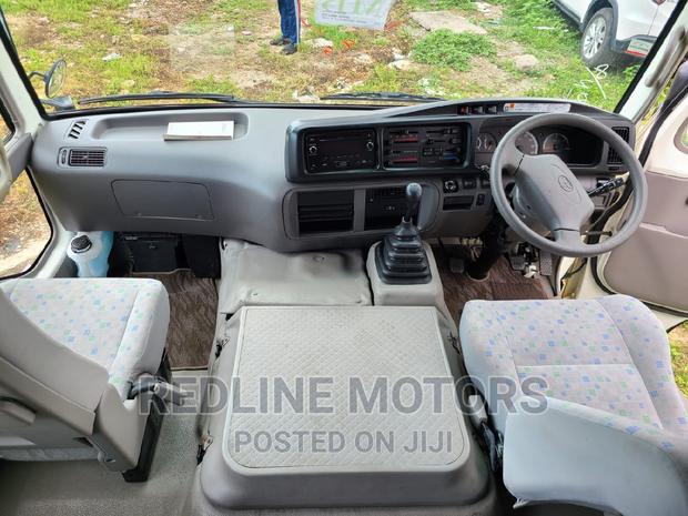 2016 Toyota Coaster Pearl Edition: Comfortable and Durable Minivan for Sale