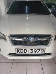 White 2014 Subaru Impreza - A High-Quality, Affordable, and Stylish Ride for sale