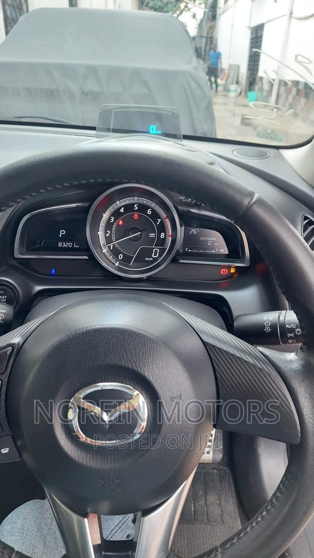 Red Mazda Demio 2017: Compact Car with Style & Efficiency