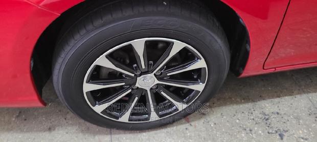 Red Pre-owned 2016 Toyota Corolla Fielder