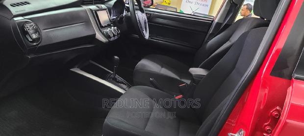 Red Pre-owned 2016 Toyota Corolla Fielder