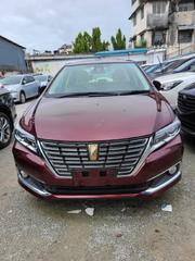 16 Toyota Premio Red Hatchback with 45,000 miles, manual transmission, and sunroof. for sale