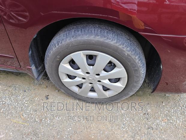 16 Toyota Premio Red Hatchback with 45,000 miles, manual transmission, and sunroof.