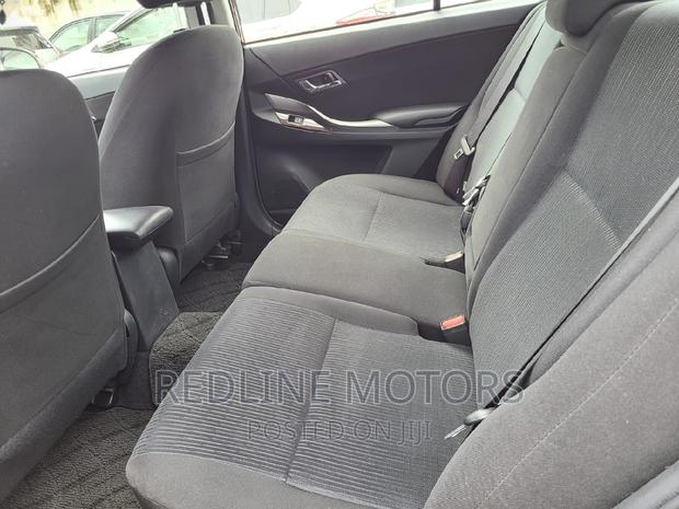 2016 Toyota Allion: Red Sedan, Perfect for Your Commute