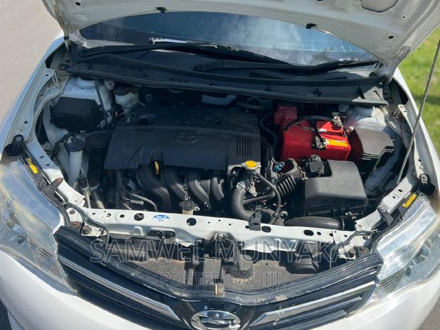 White Toyota Corolla Fielder 2015 - Affordable Luxury Sedan