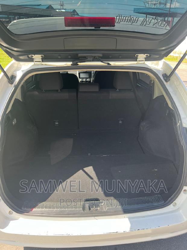White Toyota Corolla Fielder 2015 - Affordable Luxury Sedan