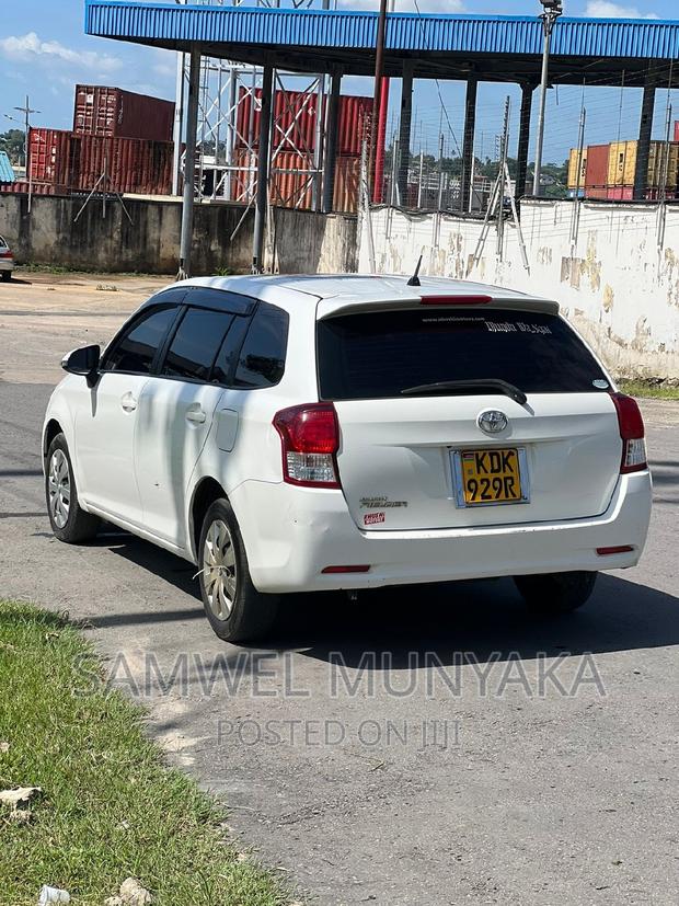 White Toyota Corolla Fielder 2015 - Affordable Luxury Sedan