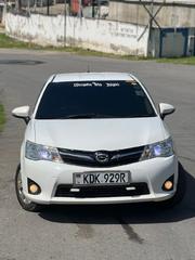 White Toyota Corolla Fielder 2015 - Affordable Luxury Sedan for sale
