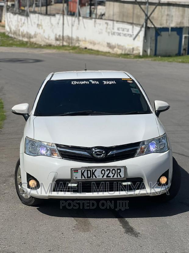 White Toyota Corolla Fielder 2015 - Affordable Luxury Sedan