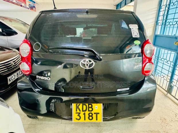 Sleek 2013 Black Toyota Passo - Compact Car with Excellent Fuel Efficiency